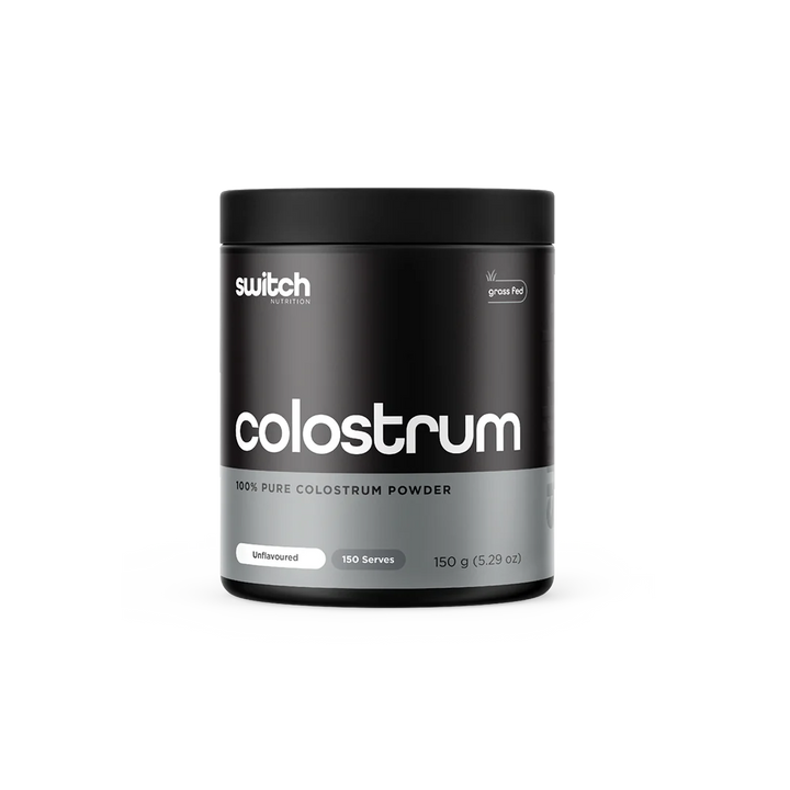 A container of Switch Nutrition Colostrum powder, with a black and white design
