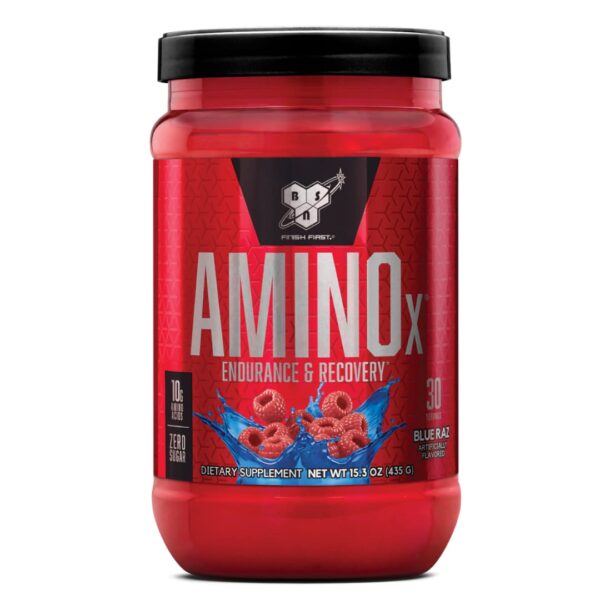 A red plastic container of BSN AMINOx powder with a black lid, labeled for endurance and recovery, featuring an image of raspberries, indicating the flavor.