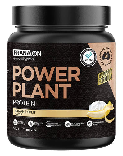 A container of Prana On Power Plant Protein powder in banana split flavor. The packaging is black with gold and white text and an image of a chocolate bar.